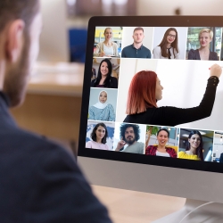 Man taking online course. View of classmates and teacher on the computer screen.