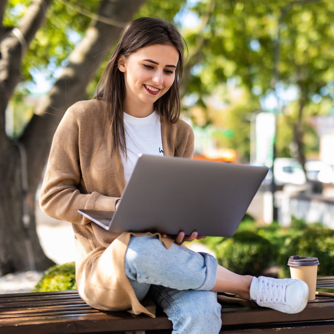 Business student taking online course outside