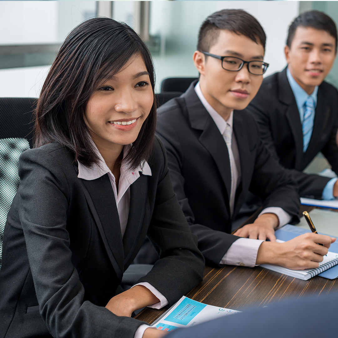 International businesspeople at a table having a meeting