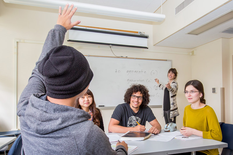 English teacher calls on student in TESOL class