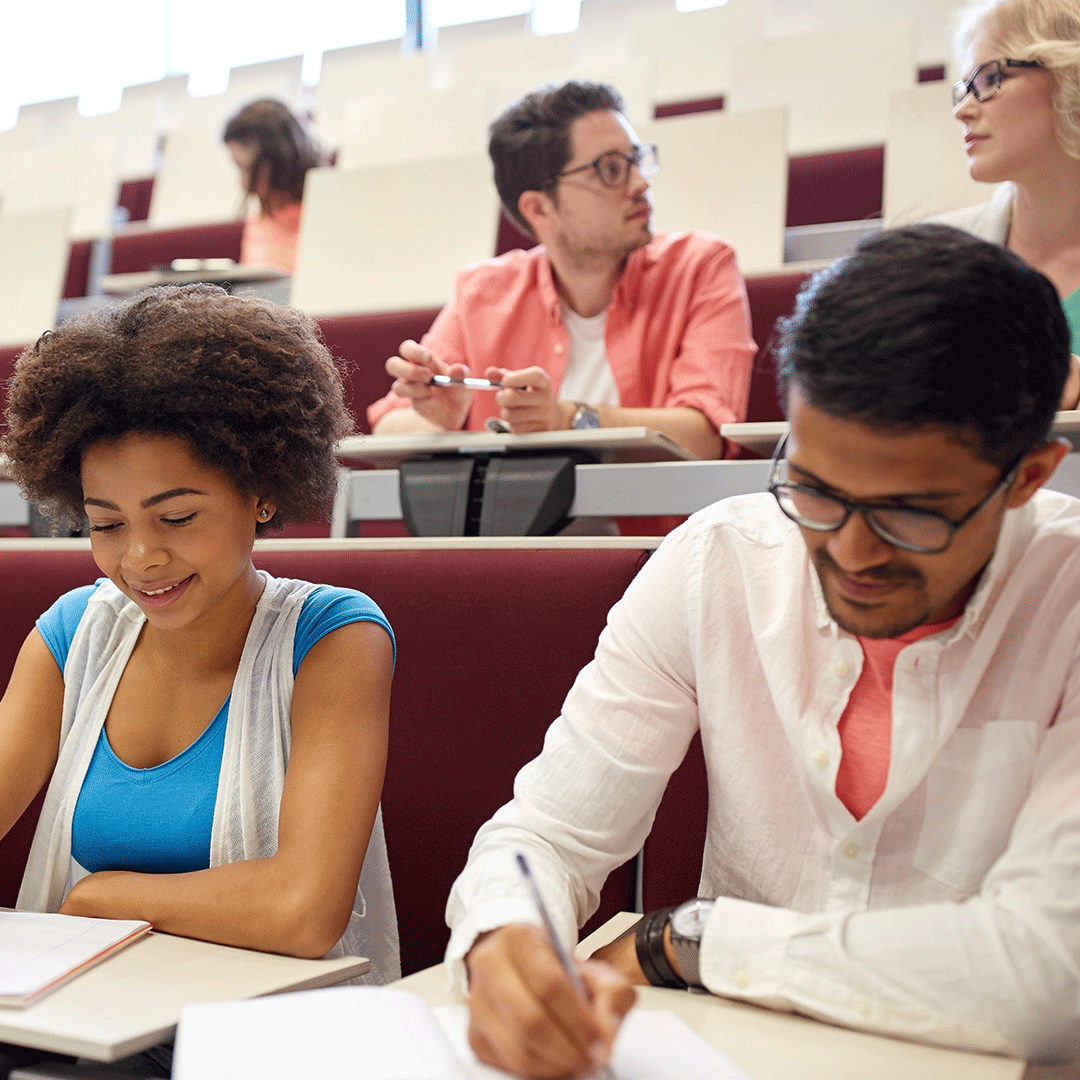 Students take a test in a lecture hall