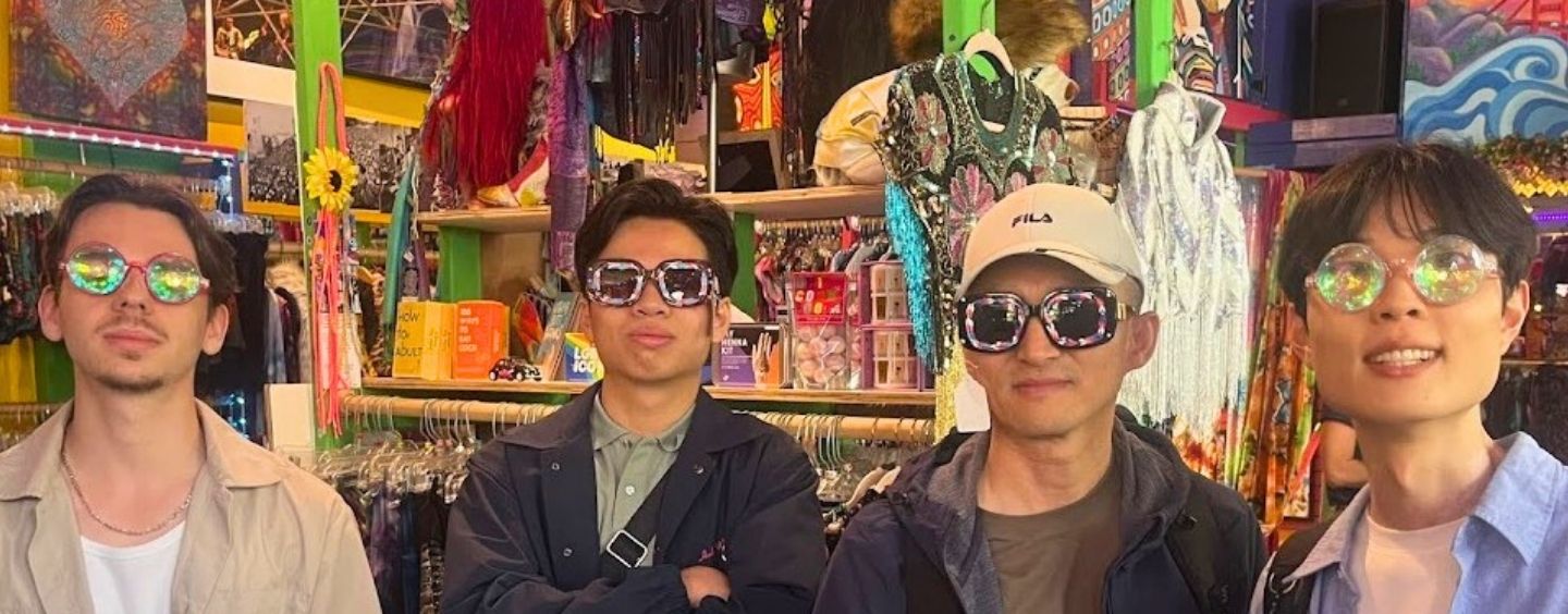 International students wear wacky glasses in a fun shop in San Francisco