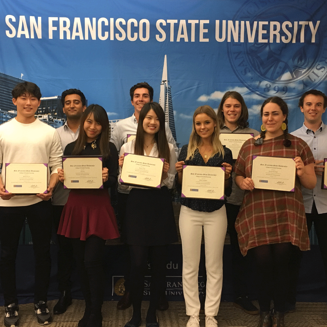 International students show their certificates