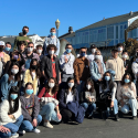 International students about to take a bay cruise. Many wear masks.