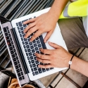 Construction worker using a laptop