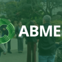 AMBES logo over a group touring the SFSU campus