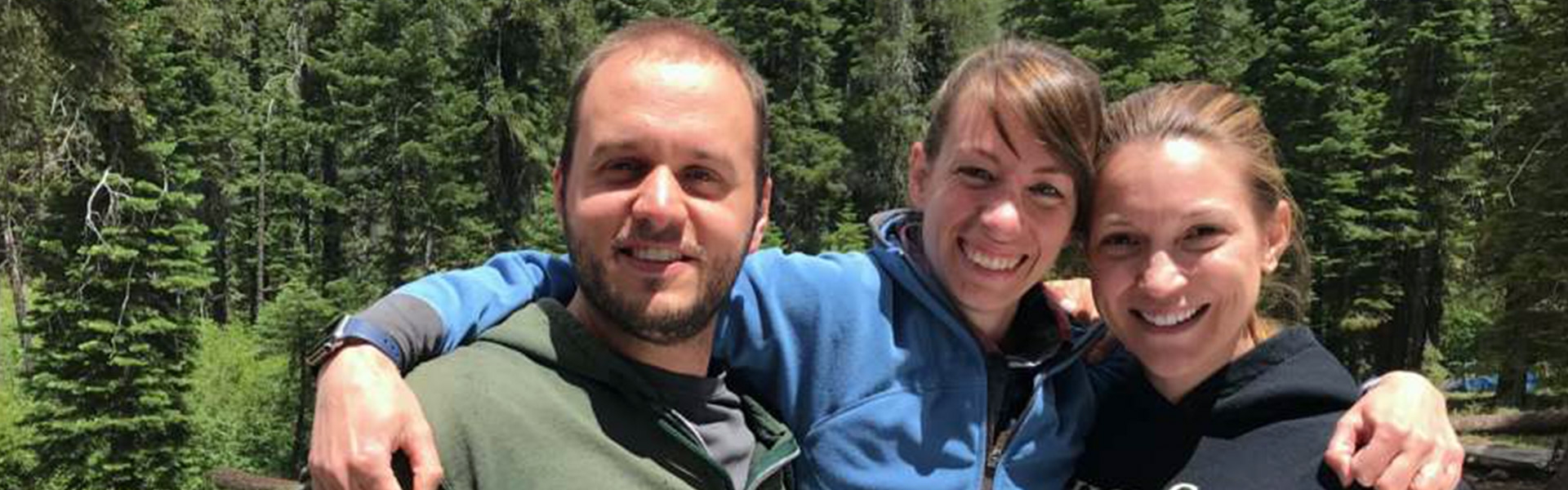 Trio of students in front of trees at the Sierra Nevada Field Campus