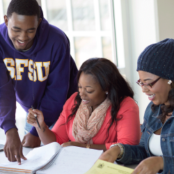 Three students study together