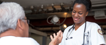 CMA smiles while speaking with patient